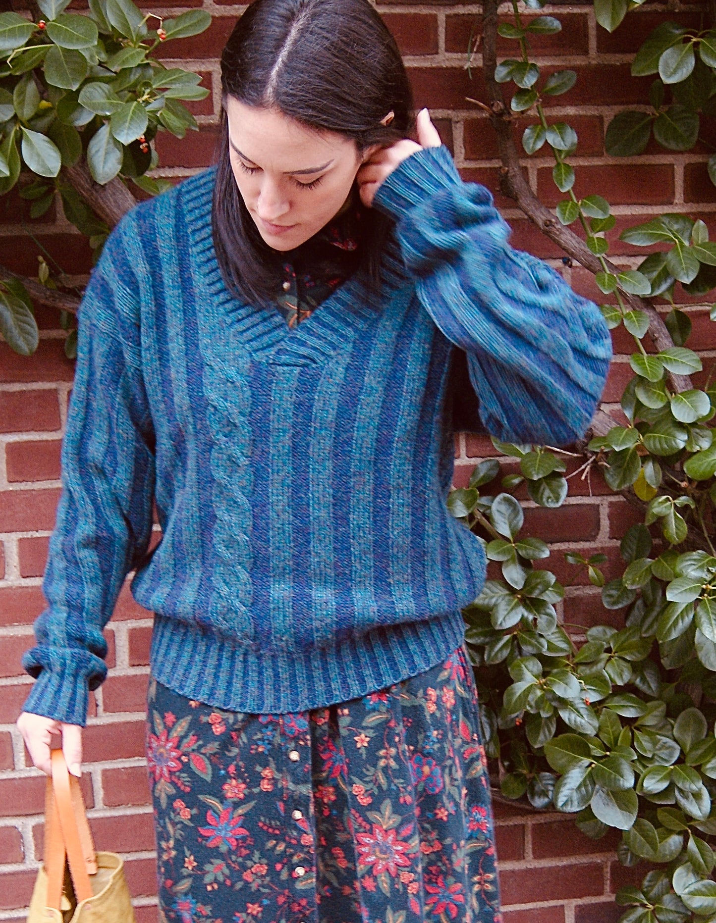 deep v-neck wool sweater with a blend of dark turquoise & purple in vertical stripes