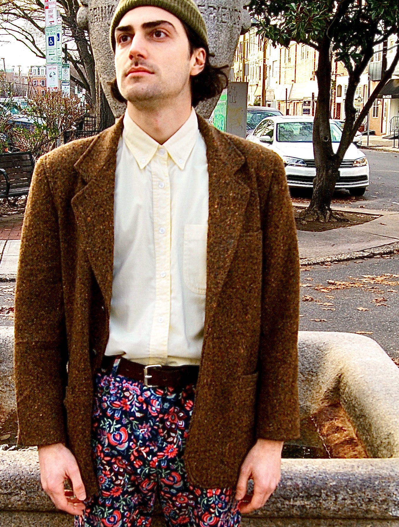With the typical shoulder pads and shorter sleeves of the early nineties, this tweed blazer from Liz Sport has a deep brown color