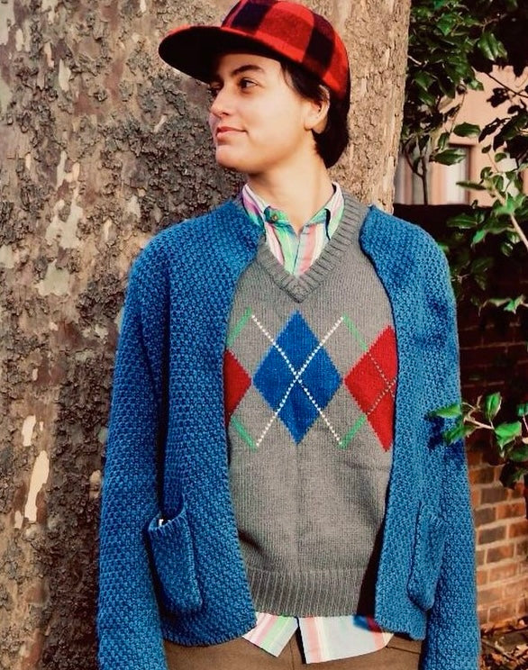 Female model wears a medium-weight blue cotton cardigan sweater without buttons from Orvis.