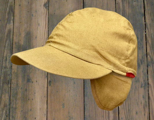 unbranded vintage tan canvas cap with fold-away ear flaps & convertible panel that allows you to change the hat’s color to red.