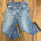 faded vintage jeans with blue-gray flannel lining and some stains on the front 