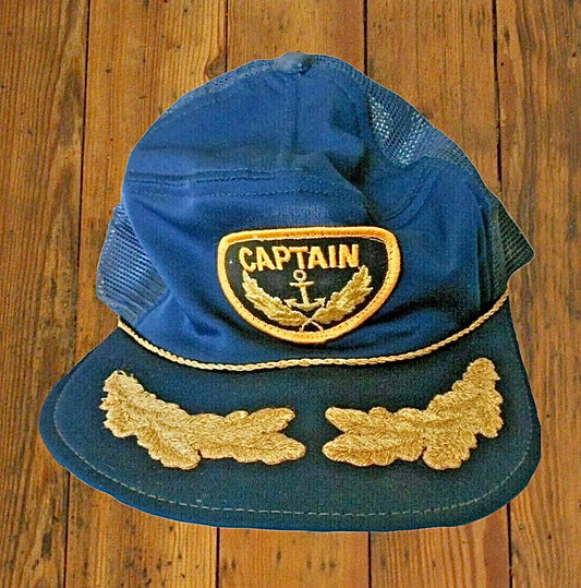 Vintage navy blue trucker-style captain’s hat that dates back to at least the 1980s, made from a loose-knit polyester for an unstructured shape.