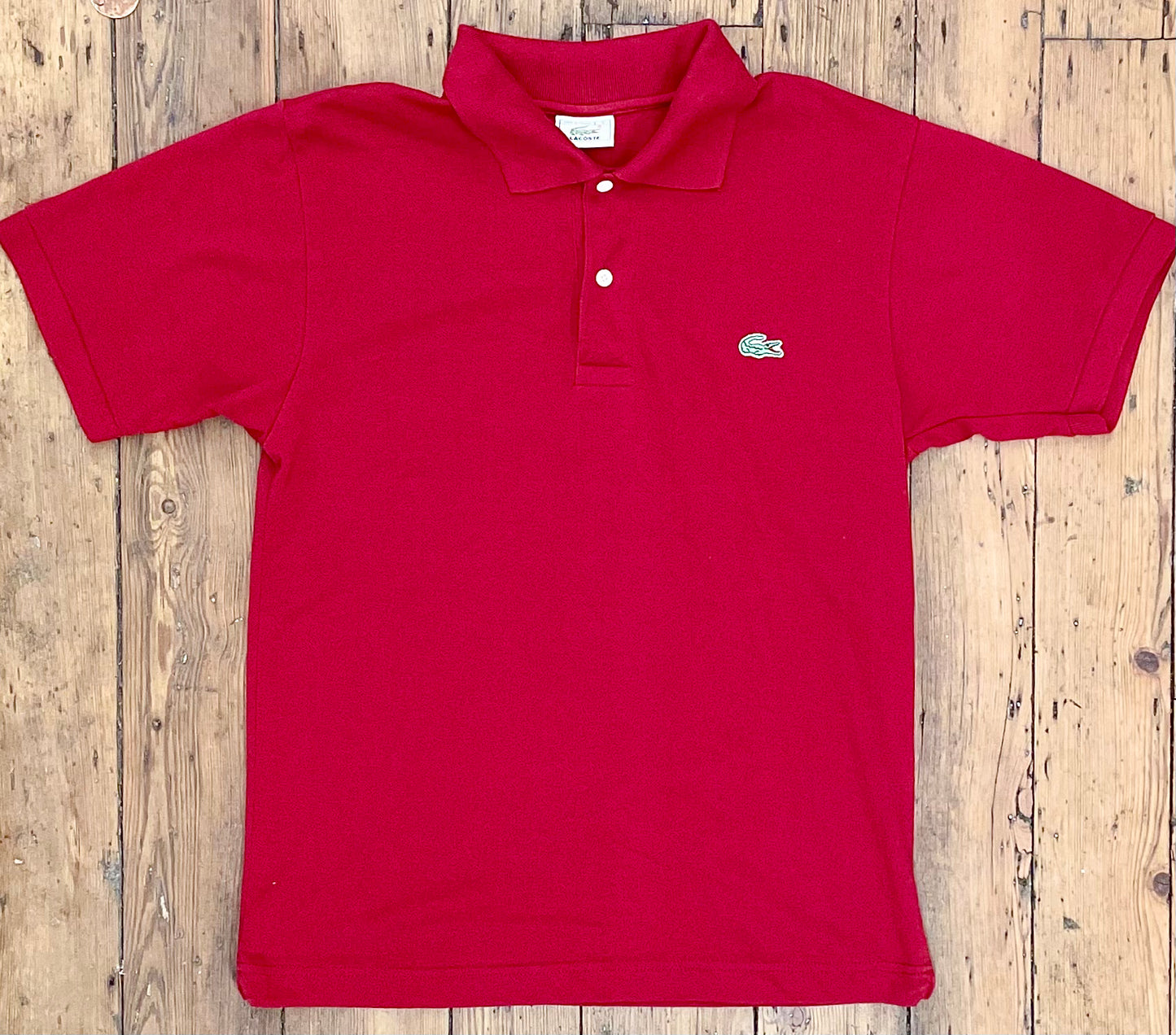 red polo shirt with classic alligator sewn-on emblem