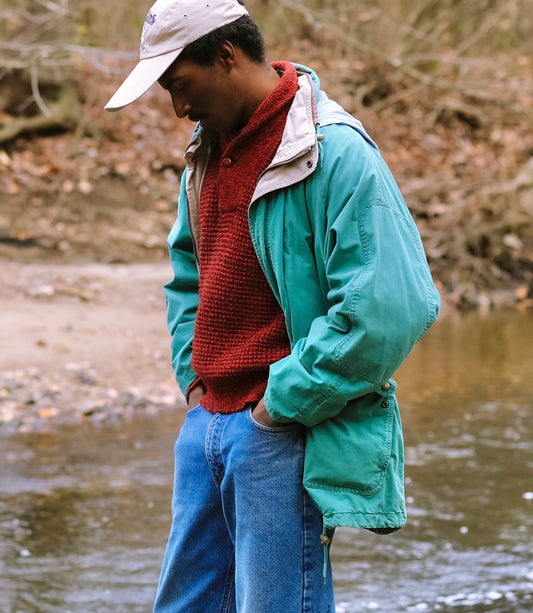 Model wearing JL Colebrook Nineties-Style Field Coat with Leather Trim while walking around Ridley Creek.