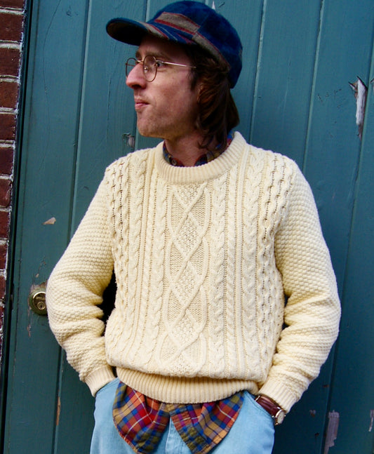 Male model wears off-white vintage cotton cable knit sweater