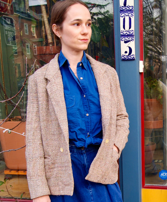 light brown vintage tweed jacket on female model