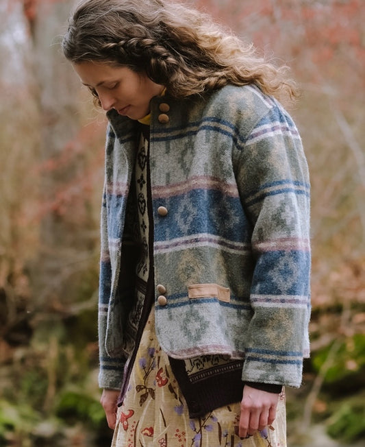 Model wearing the Woolrich Women’s Wool Waist Coat with Southwest Pattern while walking through Ridley Creek.